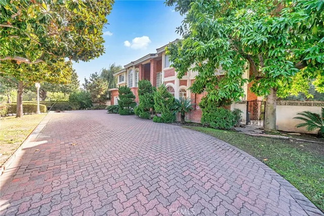 a front view of a house with a yard and a garage