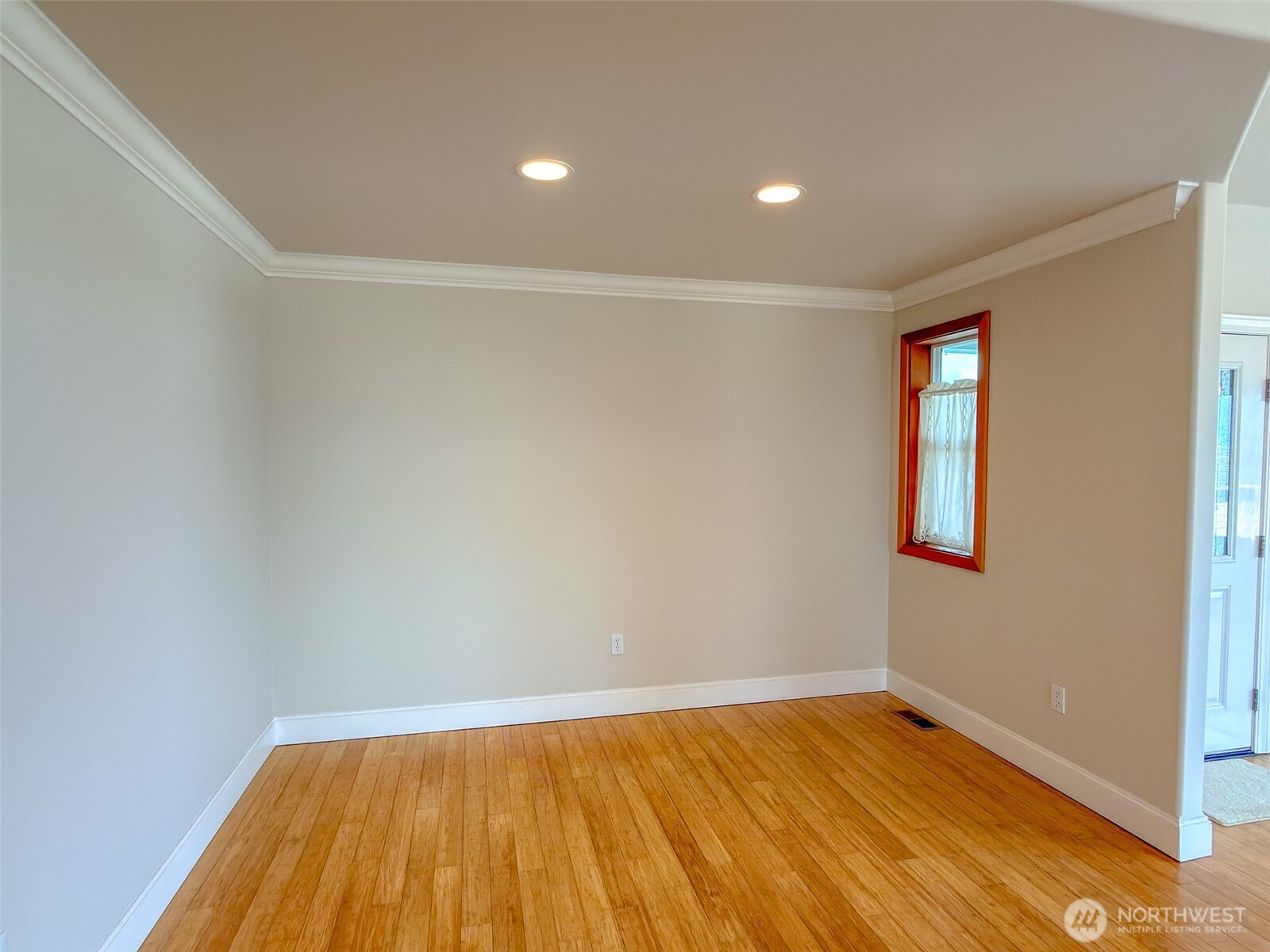 31 Opal Lane Sequim, WA 98382 - Photo 11 of 40 a view of an empty room with wooden floor and a window