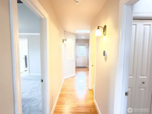 a view of a bathroom from a hallway