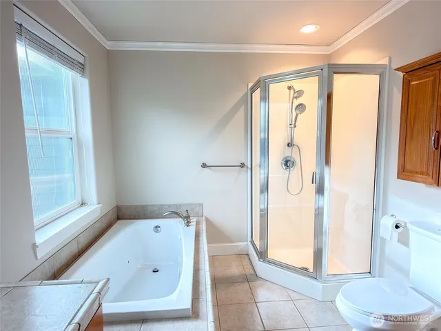 a bathroom with a tub and a shower