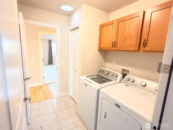 a view of storage and utility room with washer and dryer