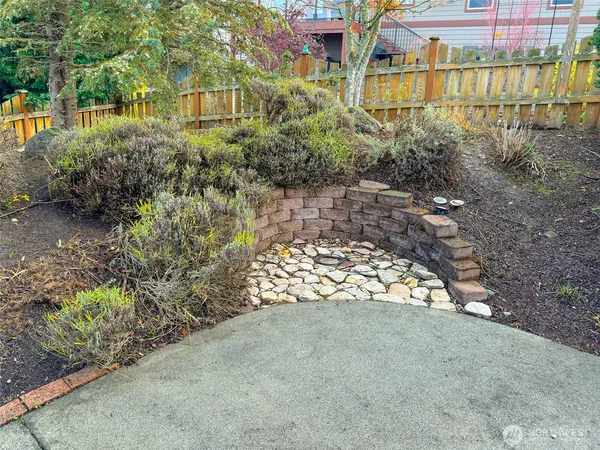 a view of a garden with a bench