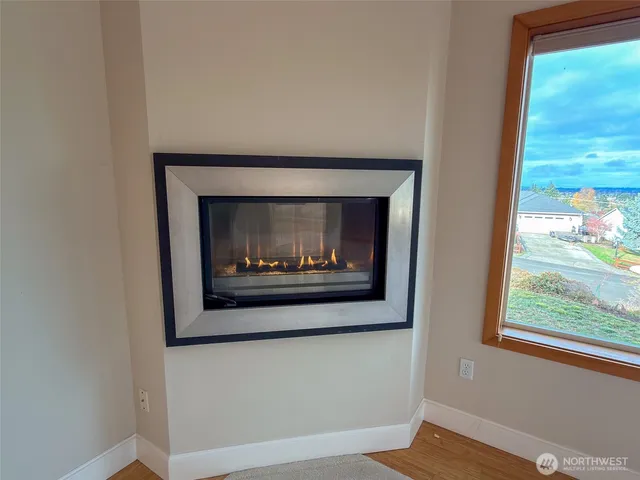 a close view of a fireplace with a hallway