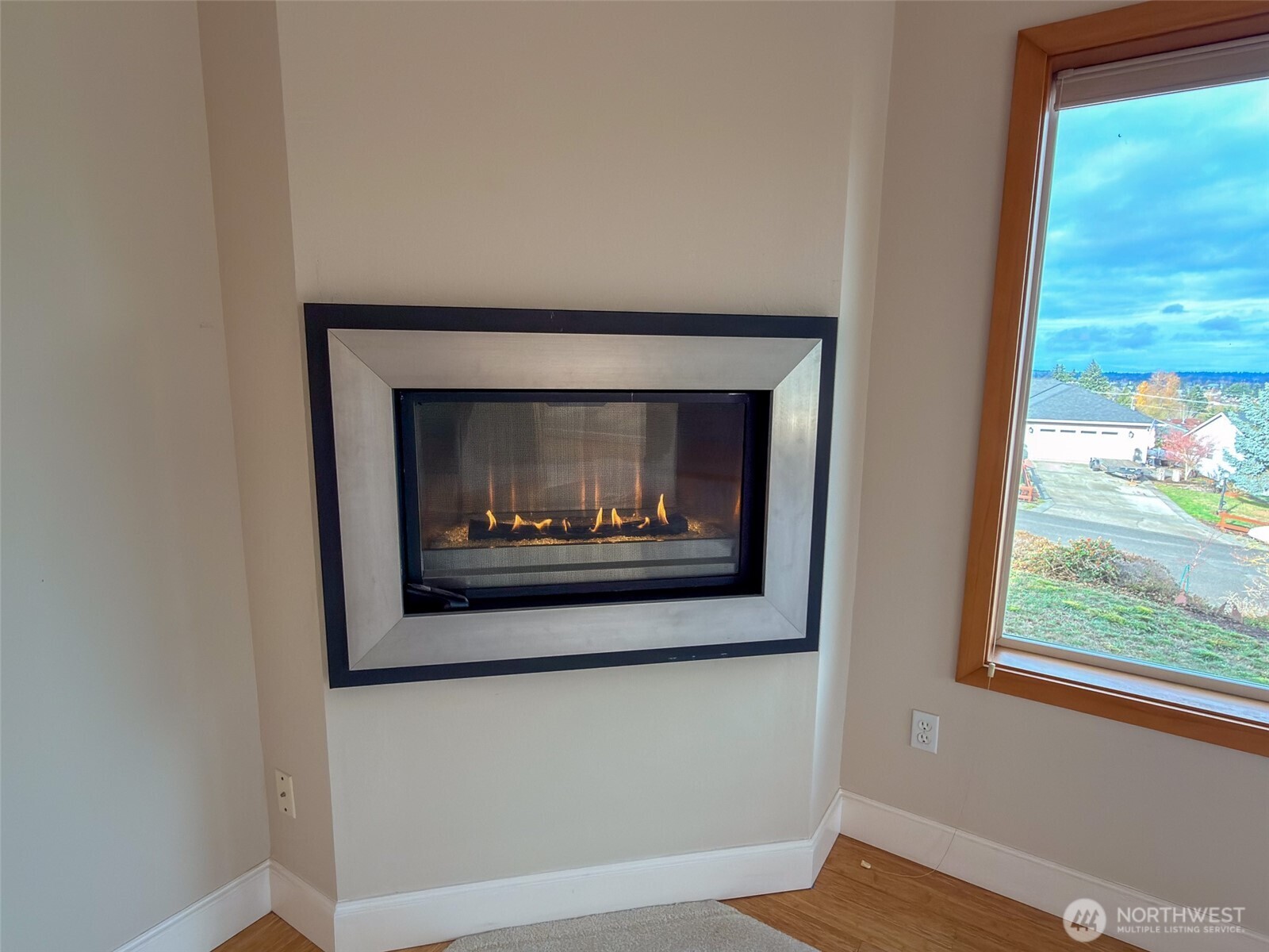 31 Opal Lane Sequim, WA 98382 - Photo 3 of 40 a close view of a fireplace with a hallway