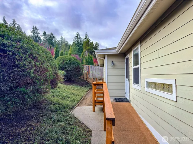a view of a balcony with two chairs and a table