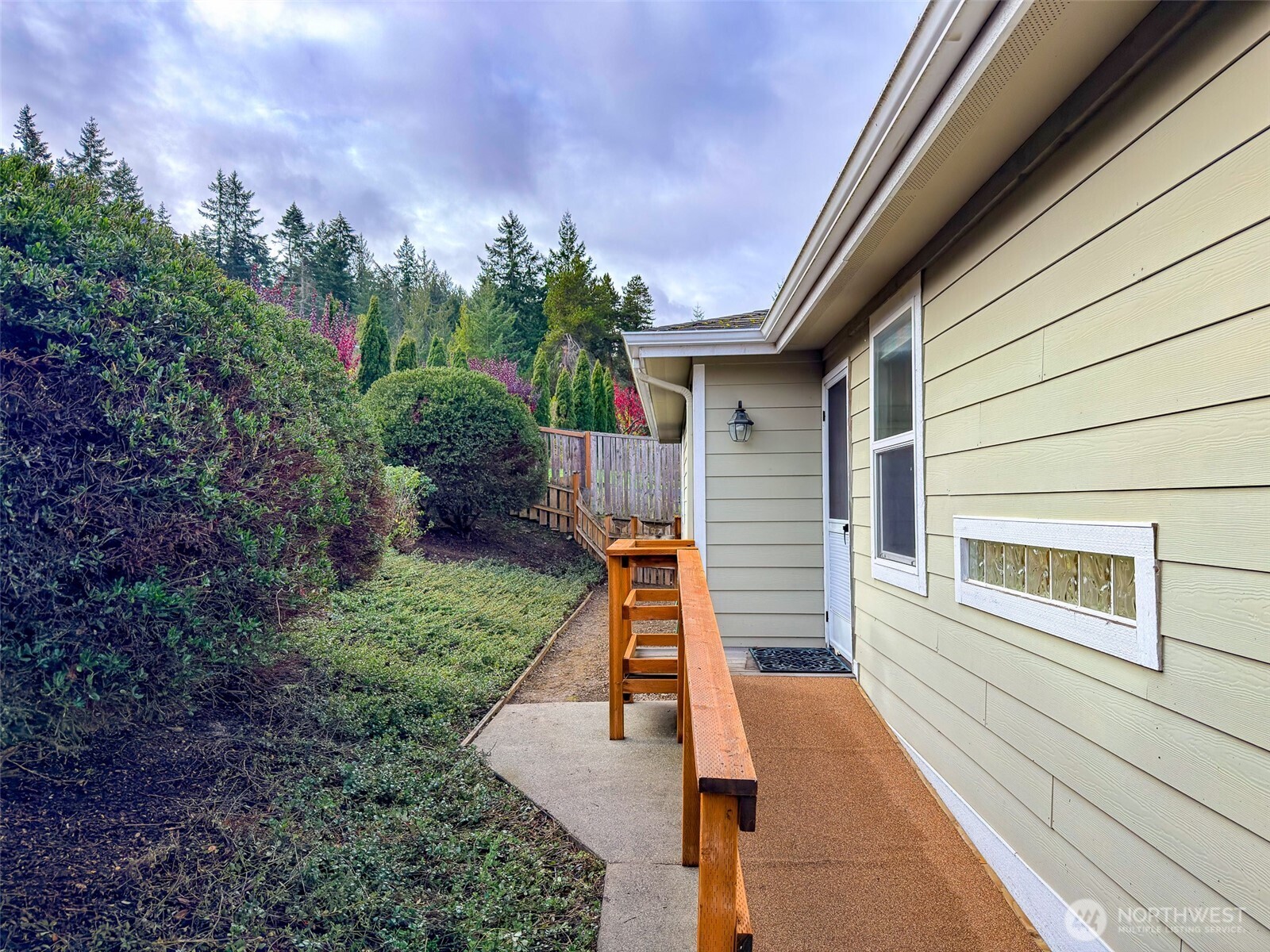 31 Opal Lane Sequim, WA 98382 - Photo 32 of 40 a view of a balcony with two chairs and a table