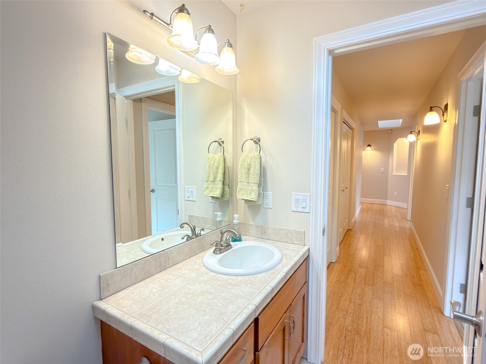 31 Opal Lane Sequim, WA 98382 - Photo 36 of 40 a bathroom with a sink vanity granite and a mirror