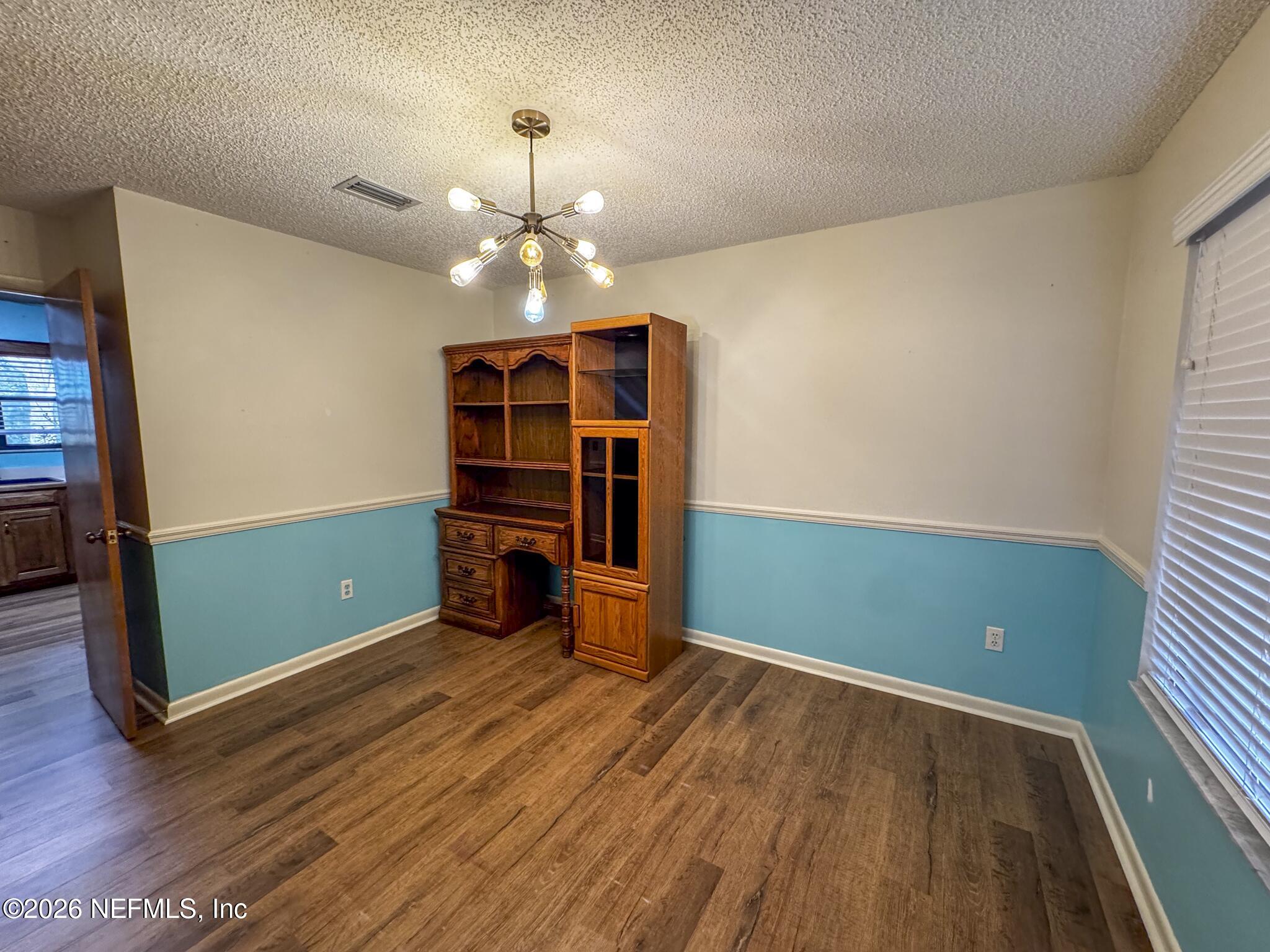 114 Mandarin Lake Road Melrose, FL 32666 - Photo 15 of 26 wooden floor in an empty room with a window