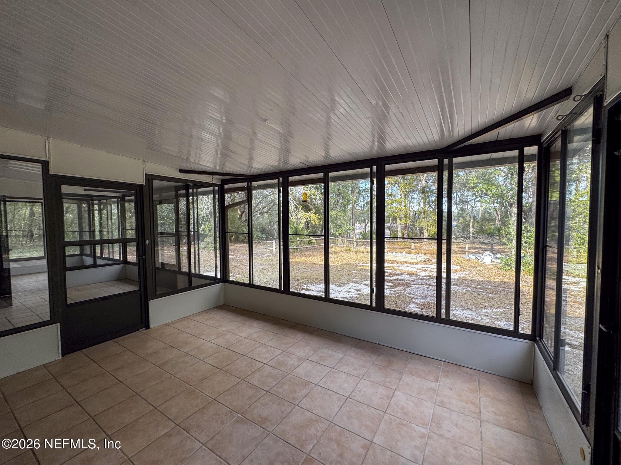 114 Mandarin Lake Road Melrose, FL 32666 - Photo 22 of 26 a view of an empty room with a large window