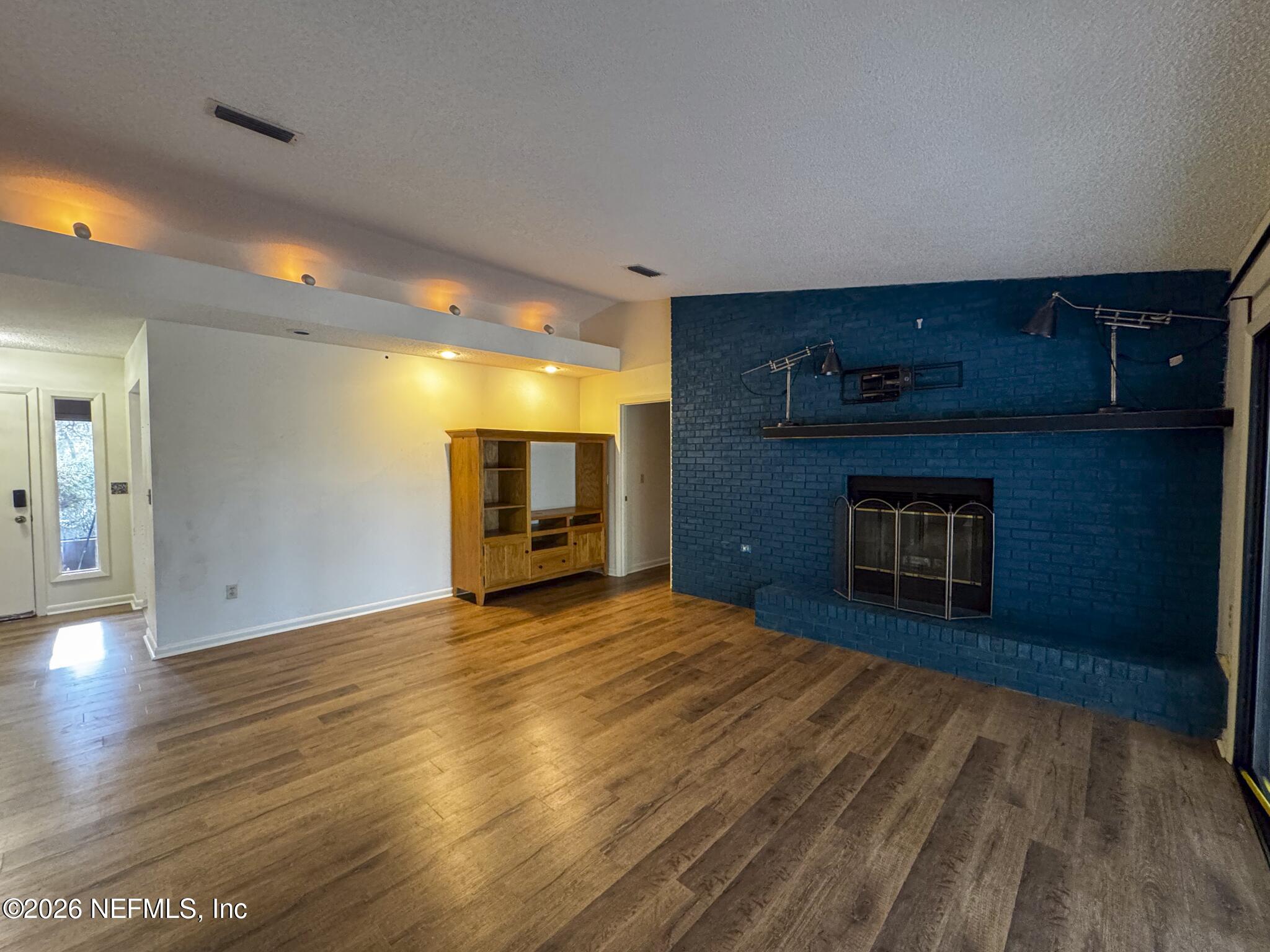 114 Mandarin Lake Road Melrose, FL 32666 - Photo 3 of 26 a view of empty room with a fireplace