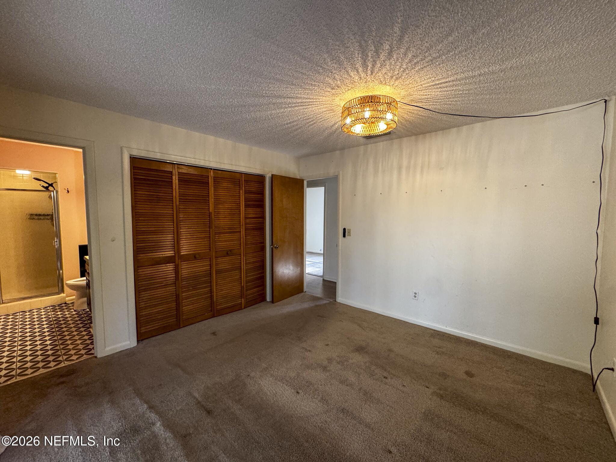 114 Mandarin Lake Road Melrose, FL 32666 - Photo 8 of 26 a view of empty room with ceiling fan