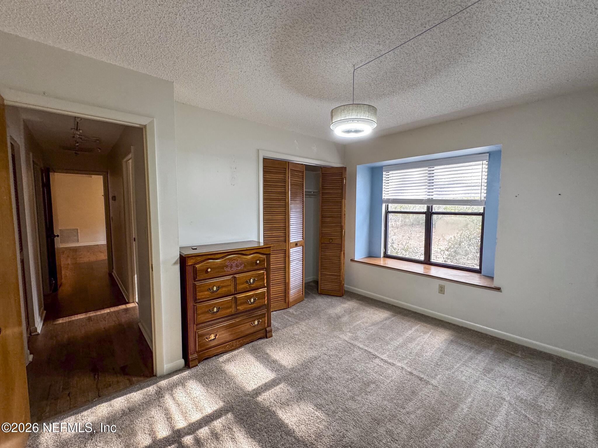 114 Mandarin Lake Road Melrose, FL 32666 - Photo 10 of 26 a view of an empty room with a window