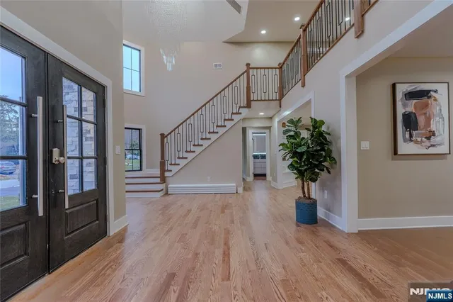 a view of an entryway with wooden floor