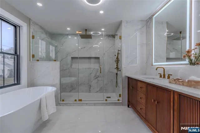 a white bath tub sitting in a bathroom