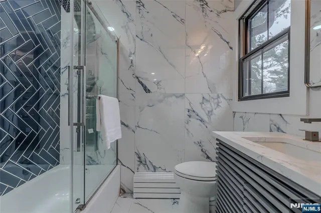 a bedroom with a large bed and a large window