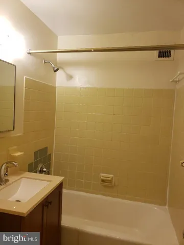 a bathroom with a sink and a shower