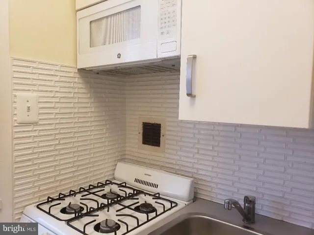 a bathroom with a sink and a stove