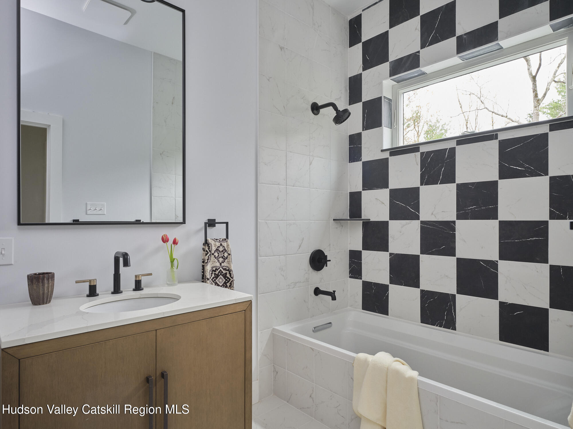 30 Dymond Road Kerhonkson, NY 12446 - Photo 43 of 52 a bathroom with a bathtub and a sink a mirror