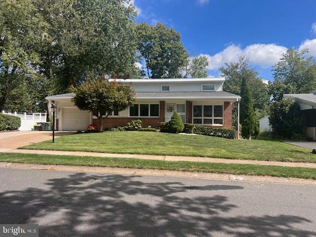 1425 Bucknell Road Wilmington, DE 19803 - Photo 2 of 36 a front view of a house with a yard