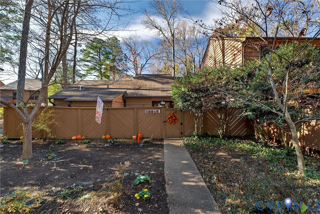 a view of a house with a large tree