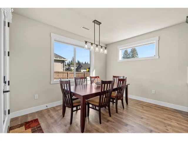 a bedroom with furniture and a flat screen tv