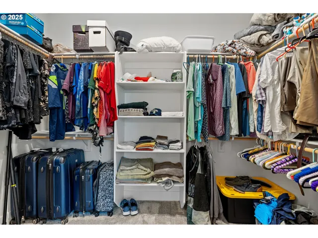 a view of a workspace with furniture and a bookshelf