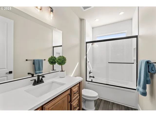 a bathroom with a sink and a washer dryer