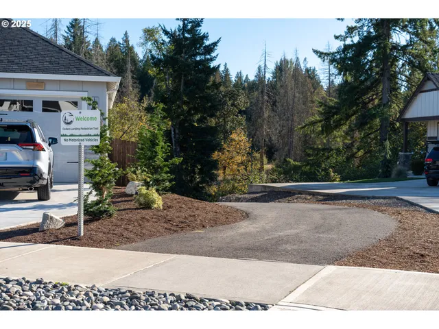 an aerial view of a house with a swimming pool
