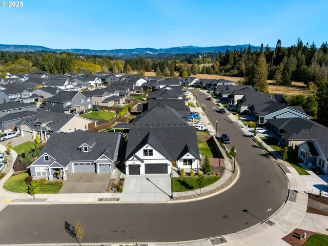 an aerial view of a house with a swimming pool