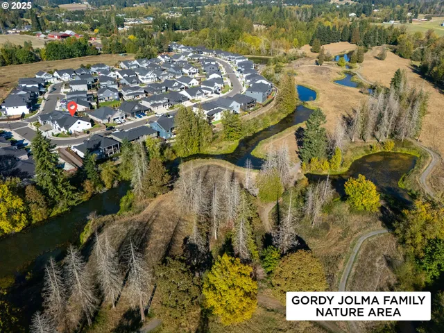 a view of a patio with a table and chairs under an umbrella
