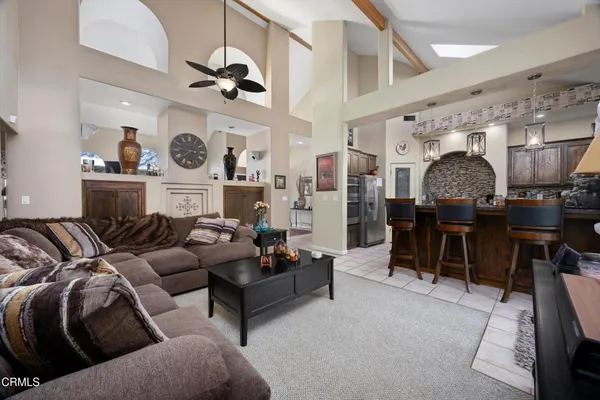a dining room filled chandelier and fireplace