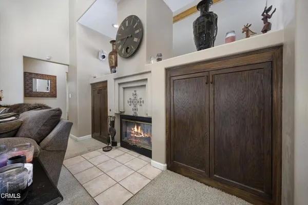 a kitchen with stainless steel appliances kitchen island granite countertop a stove a sink and a microwave