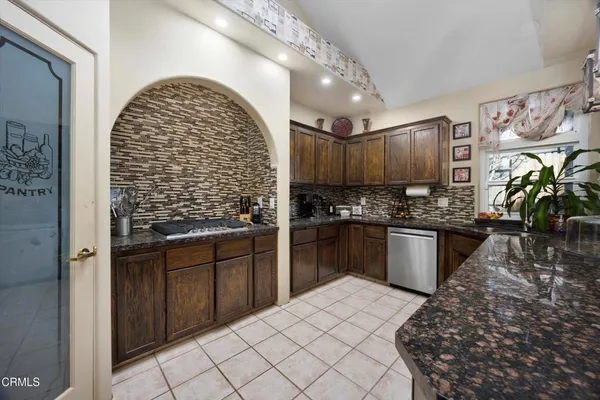 a kitchen counter top a sink and a granite counter top