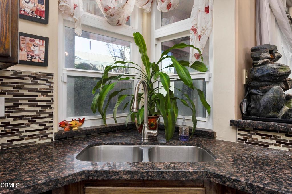 5705 Valley Street Bakersfield, CA 93306 - Photo 26 of 53 a kitchen counter top a sink and a granite counter top