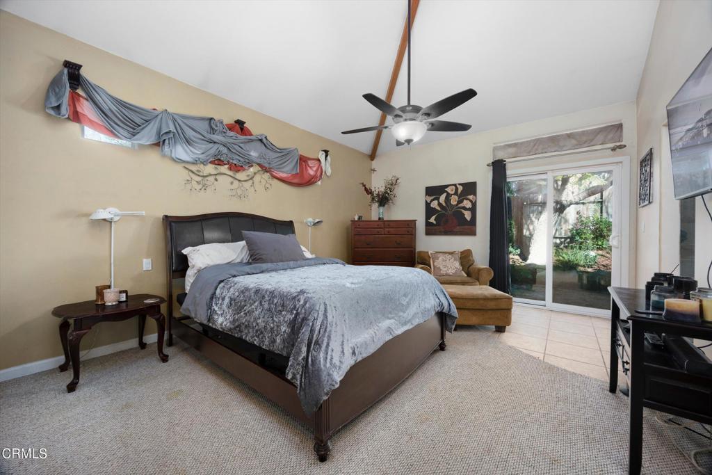 5705 Valley Street Bakersfield, CA 93306 - Photo 31 of 53 a bedroom with a bed and a chandelier