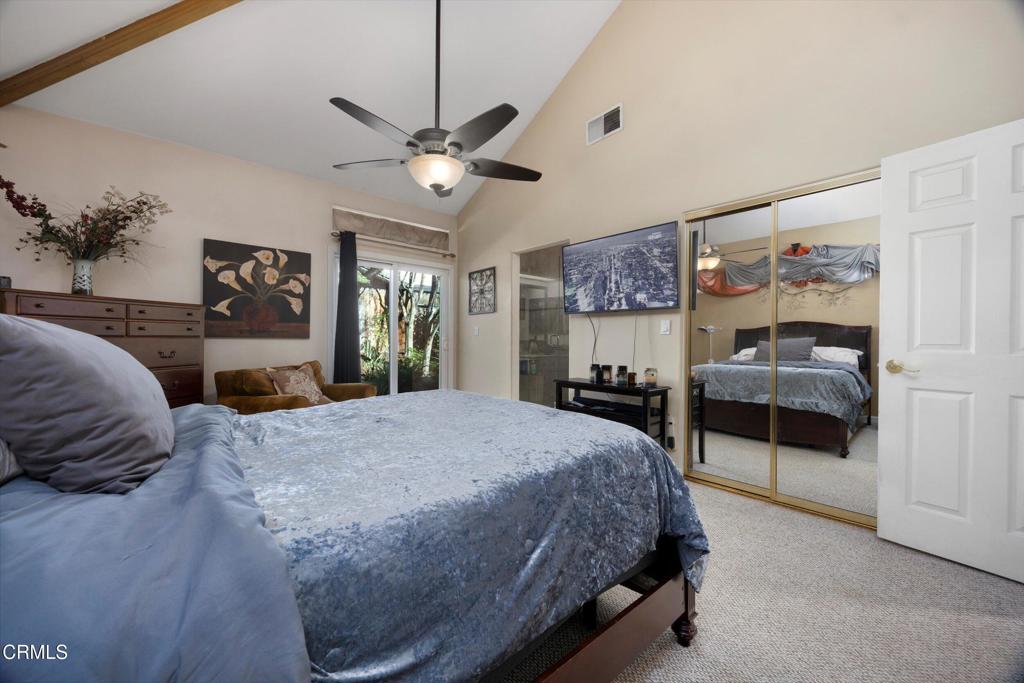 5705 Valley Street Bakersfield, CA 93306 - Photo 33 of 53 a spacious bedroom with a large bed and a chandelier