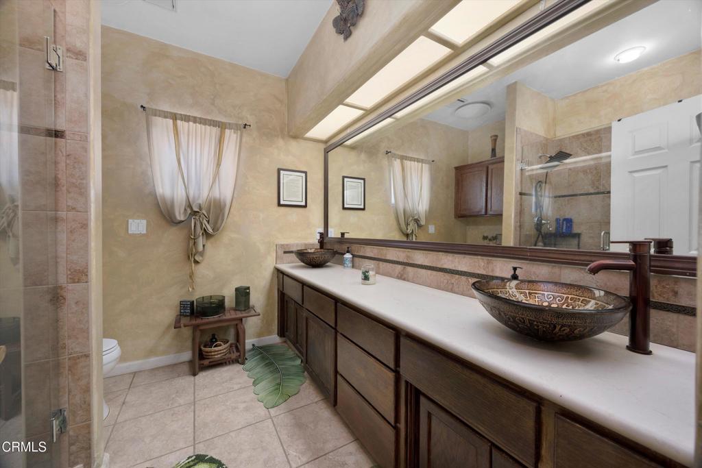 5705 Valley Street Bakersfield, CA 93306 - Photo 37 of 53 a kitchen with sink and chairs