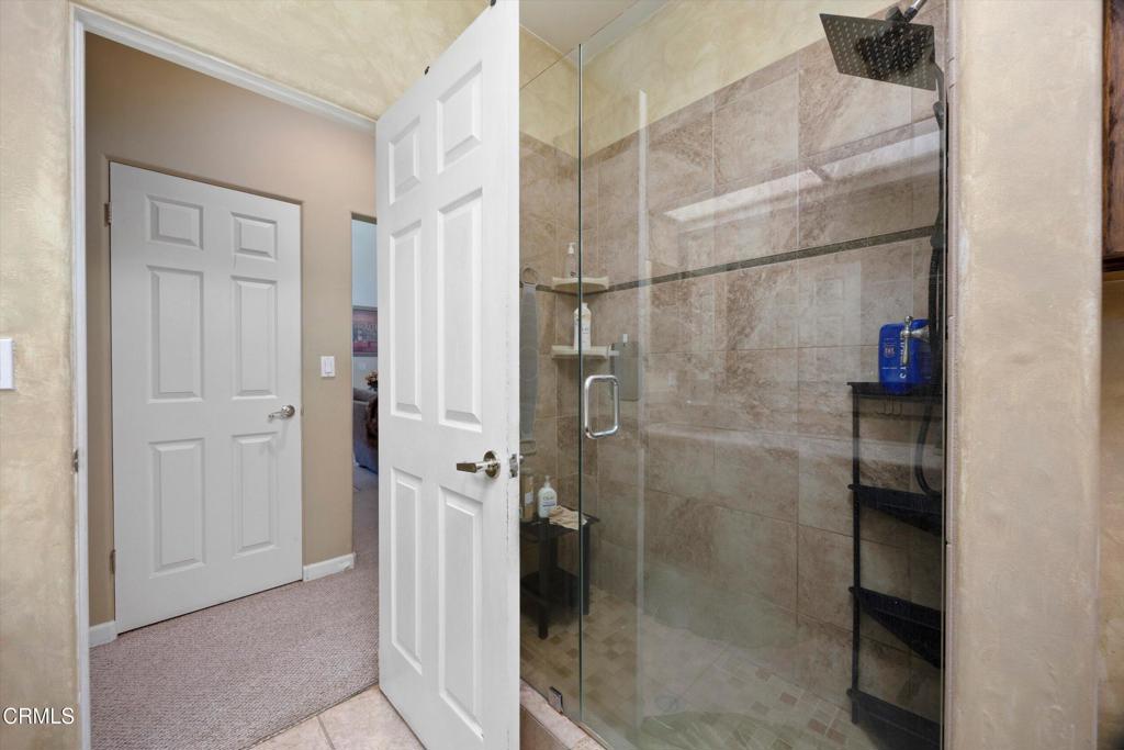 5705 Valley Street Bakersfield, CA 93306 - Photo 38 of 53 a bathroom with a glass shower door