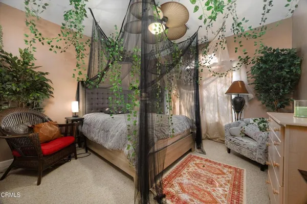 a room with furniture a rug and a window