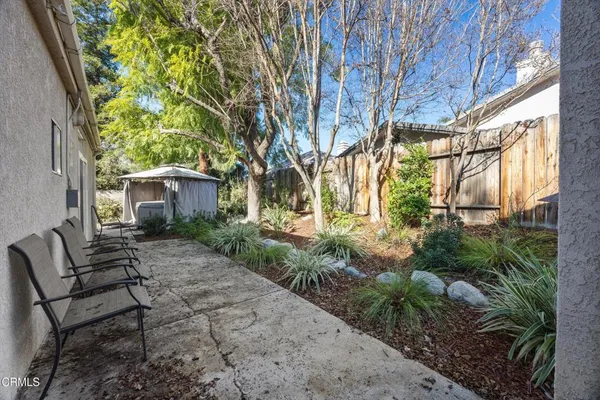 front view of a house with a tree