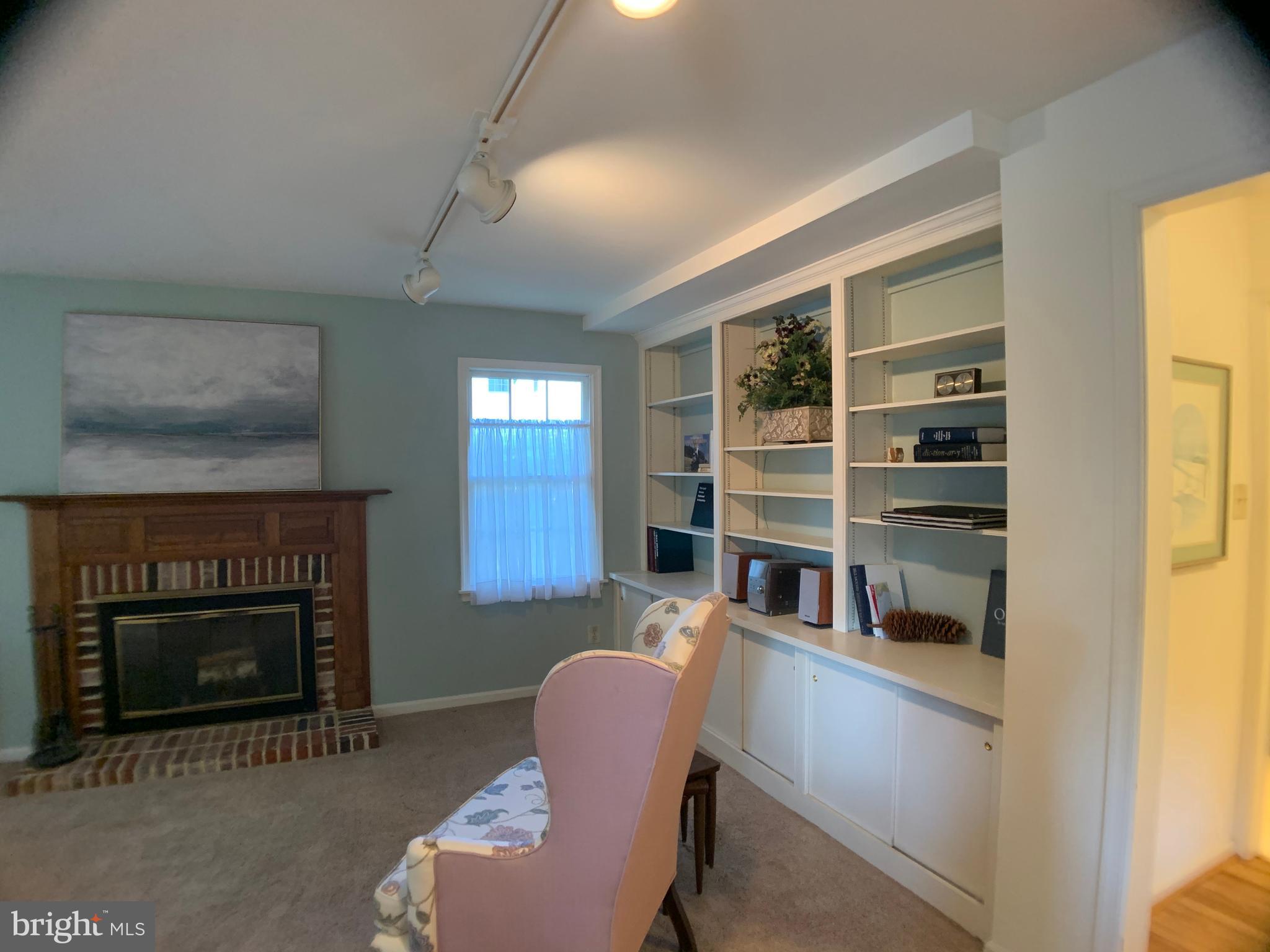 110 Fennerton Road Paoli, PA 19301 - Photo 13 of 34 Bookshelves and Fireplace in Family Room