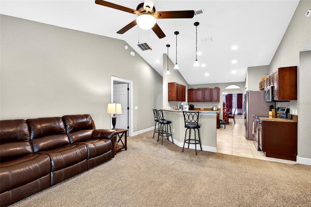 3001 Southwest 173rd Street Road Ocala, FL 34473 - Photo 15 of 28 a living room with furniture and kitchen view