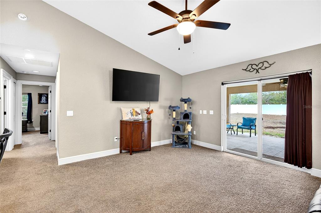 3001 Southwest 173rd Street Road Ocala, FL 34473 - Photo 16 of 28 a view of a livingroom with a flat screen tv