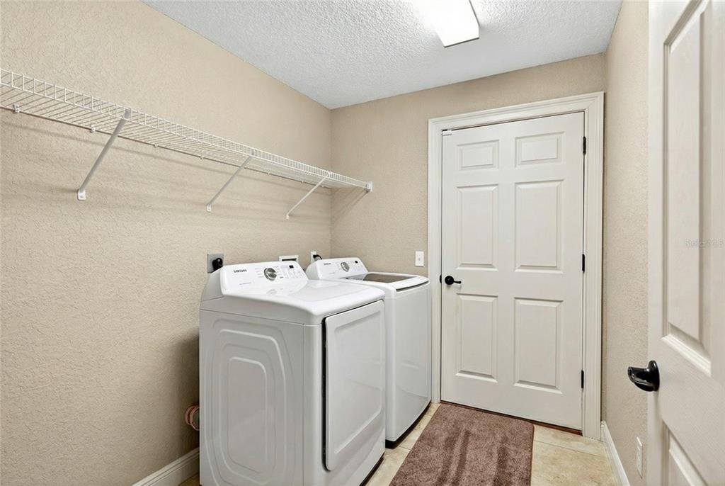 3001 Southwest 173rd Street Road Ocala, FL 34473 - Photo 20 of 28 a utility room with dryer and washer