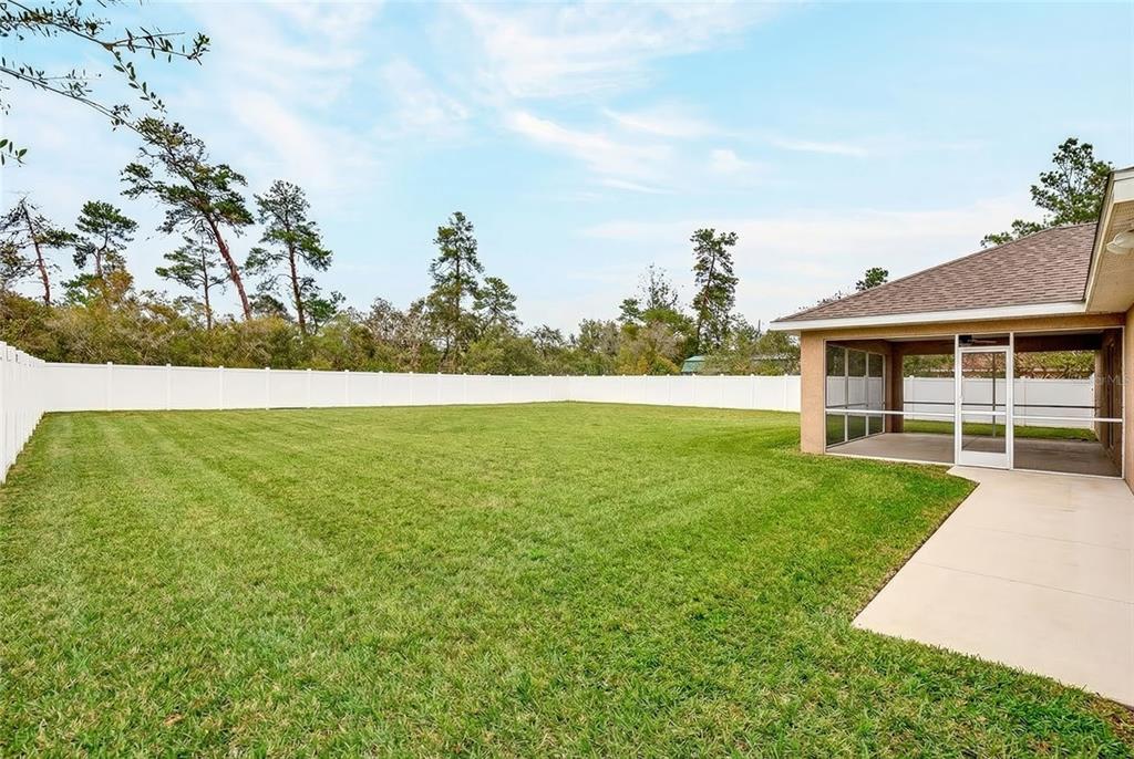 3001 Southwest 173rd Street Road Ocala, FL 34473 - Photo 25 of 28 a view of an house with backyard space and balcony