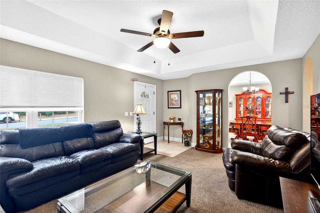 3001 Southwest 173rd Street Road Ocala, FL 34473 - Photo 6 of 28 a living room with furniture and a large window