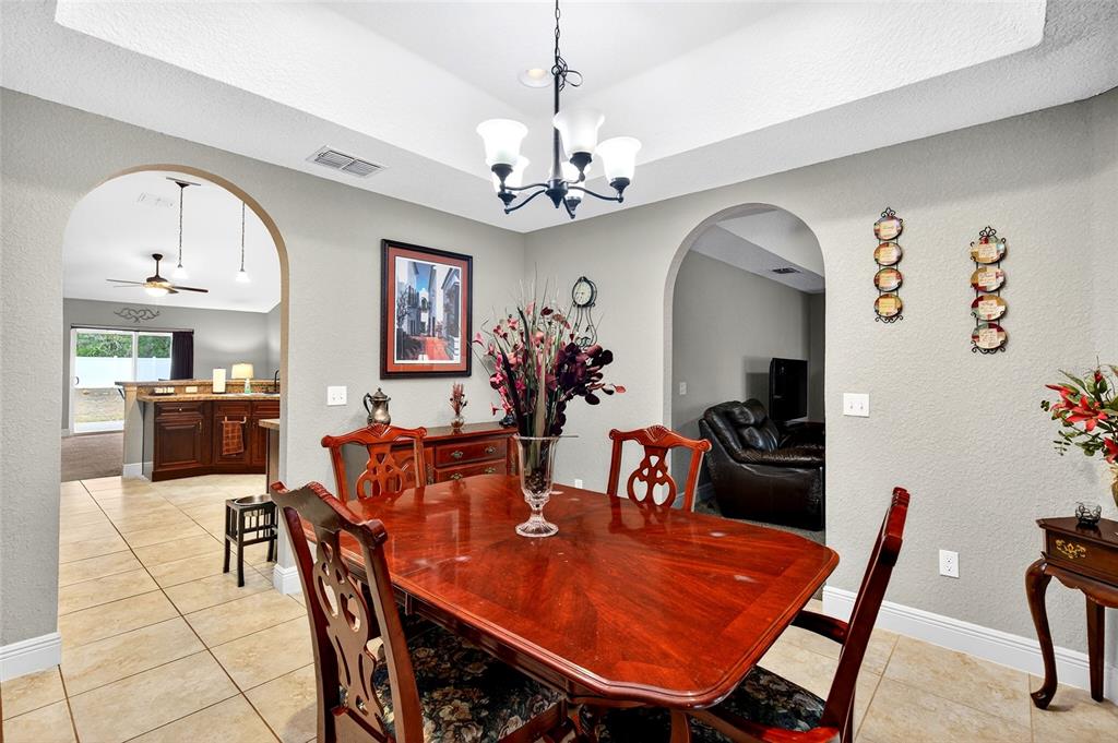 3001 Southwest 173rd Street Road Ocala, FL 34473 - Photo 9 of 28 a view of a dining room with furniture