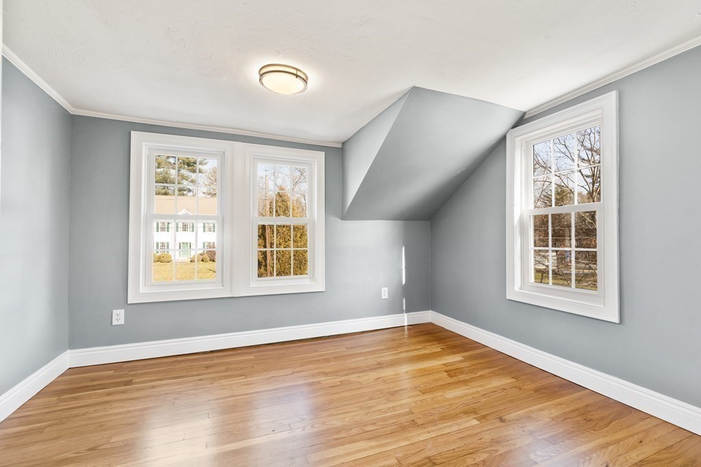 2 Pine Grove Road Westford, MA 01886 - Photo 19 of 27 a view of an empty room with wooden floor and a window