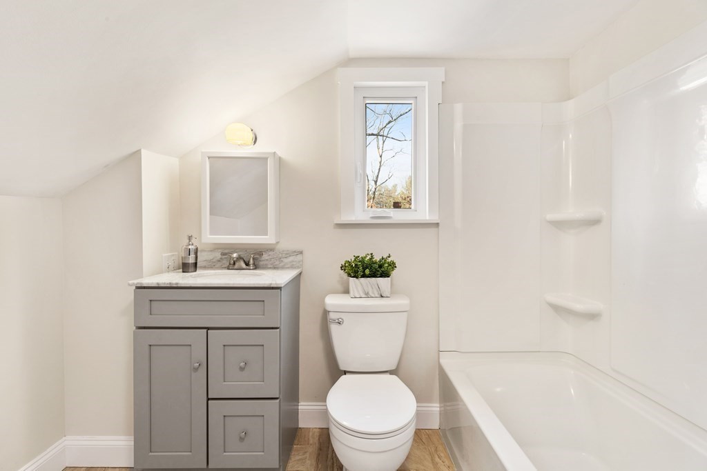 2 Pine Grove Road Westford, MA 01886 - Photo 21 of 27 a bathroom with a sink a toilet and shower