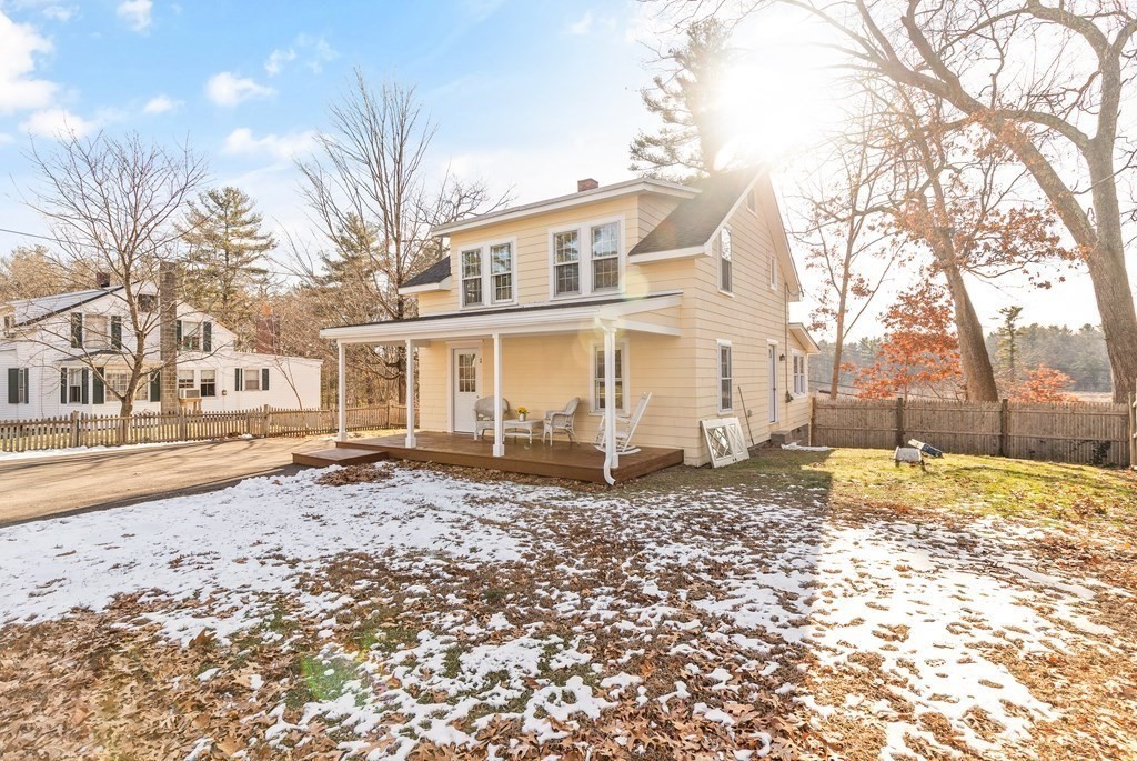 2 Pine Grove Road Westford, MA 01886 - Photo 26 of 27 a view of a old house with a yard covered in snow